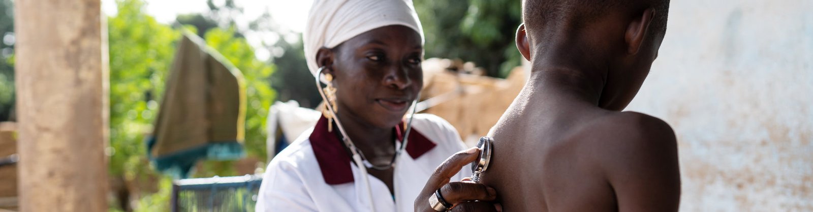 smiling nurse checking her patient