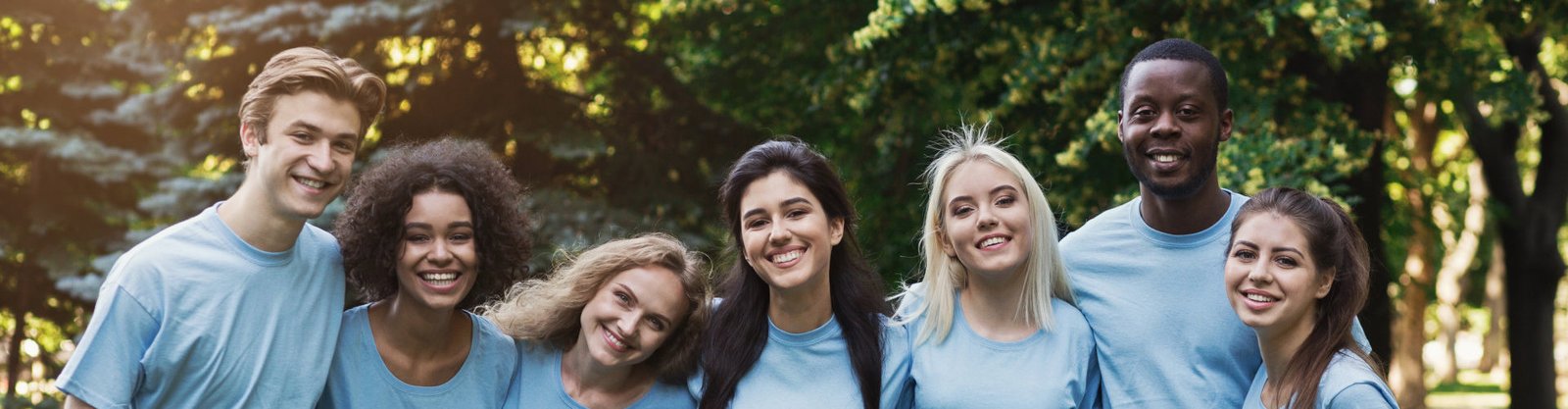 people smiling happily facing the camera