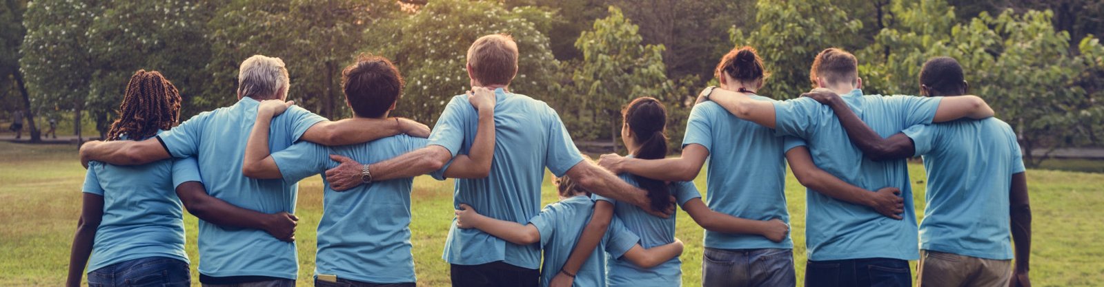 a group of people wearing blue t shirt